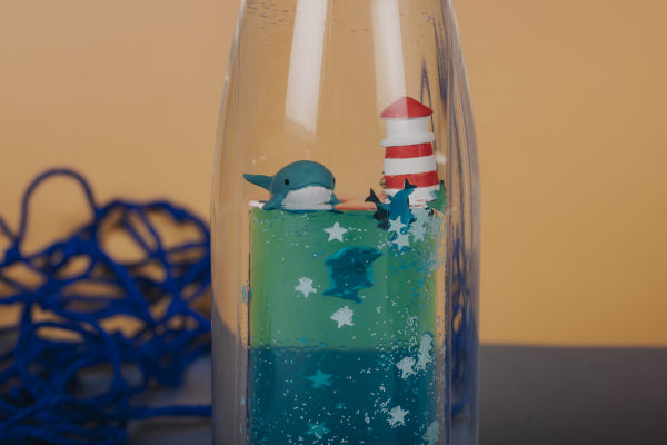 Petit Boum Bouteille sensorielle Move Baleine